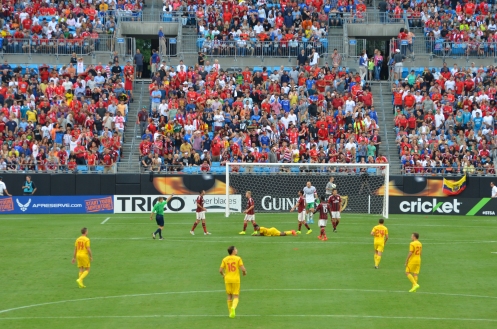 Liverpool FC wearing their away colors, in yellow, against AC Milan in Charlotte, NC on 2 August 2014