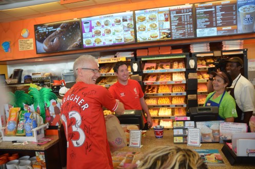 Super Fan, David Cruise, accepting a donut sale from Robbie Fowler